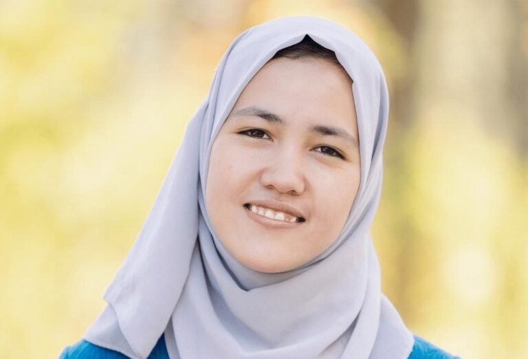 Masuda, an ASRF student, smiling outdoors